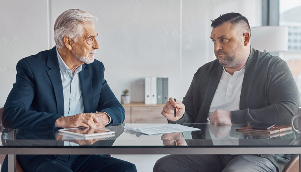 Business owner calculating due diligence fee and earnest money deposit requirements